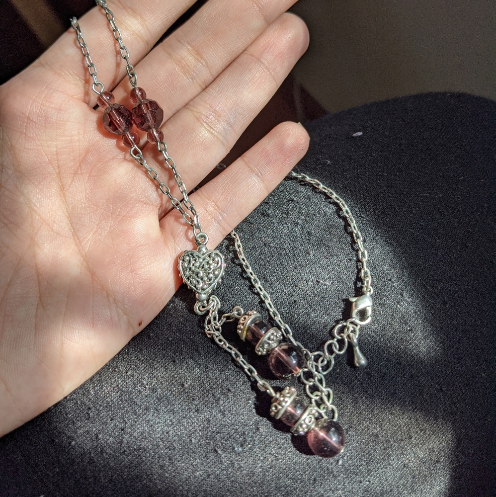 Silver necklace with heart pendant and beads